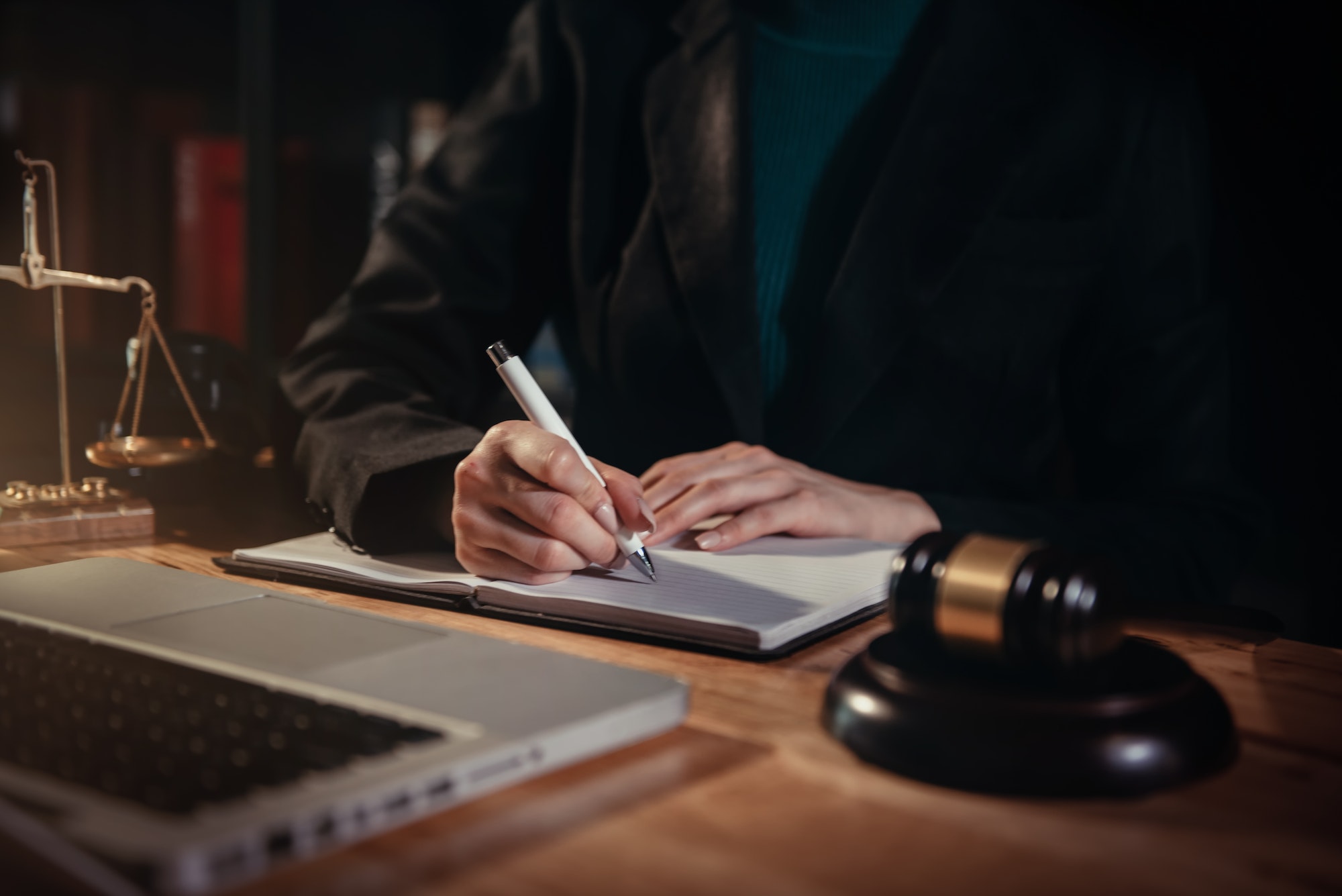 Lawyer businessmen sitting at desk and making notes.